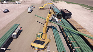 Pipe loaded on Adams Truck